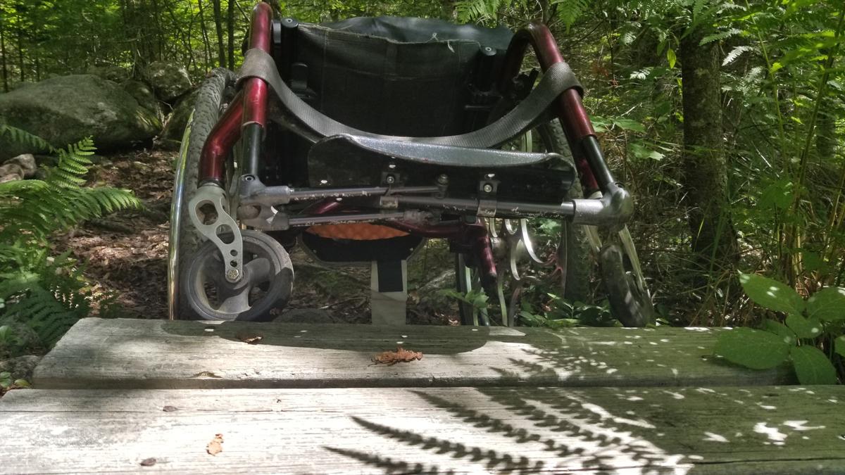 Getting the wheelchair onto the boardwalk.