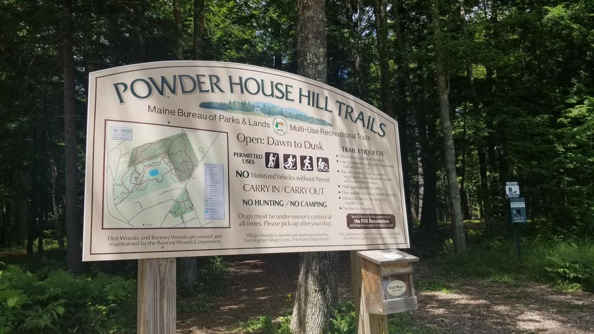 Sign at the parking lot for the Powder House Hill Trails.