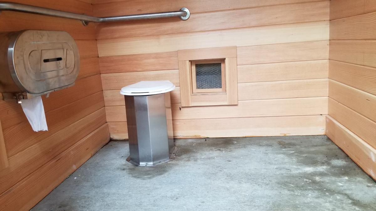 Inside the accessible outhouse.