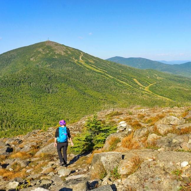 A hiker on an exposed mountain top