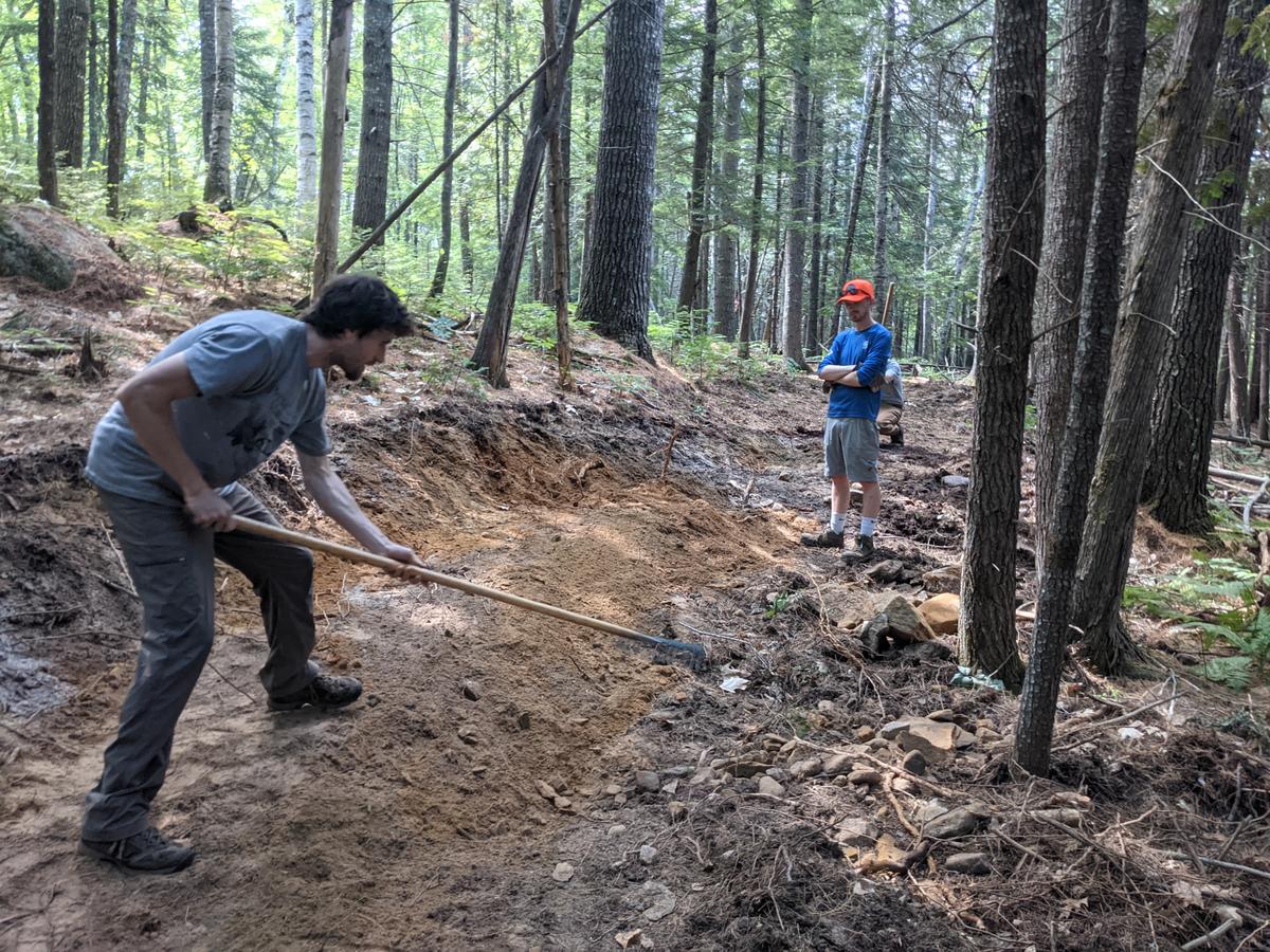 Digging a trail with the Kennebec Land Trust.