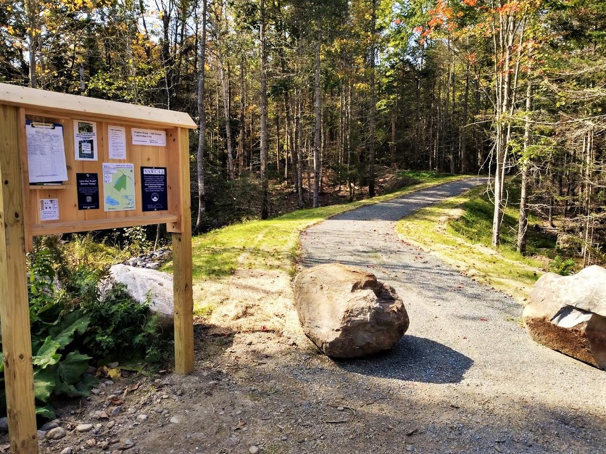 The 6-foot wide ADA trail is hard-packed gravel with minimal grades, allowing hikers of all types and abilities to enjoy this trail. (pc: Blue Hill Heritage Trust)