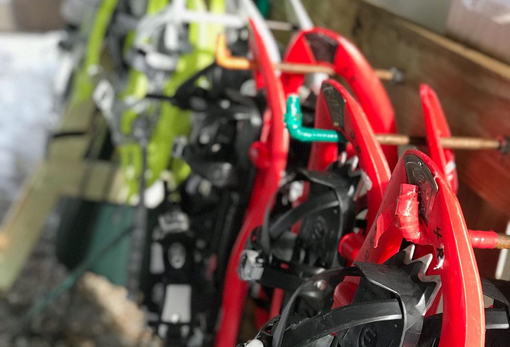A row of snowshoes is ready for rental