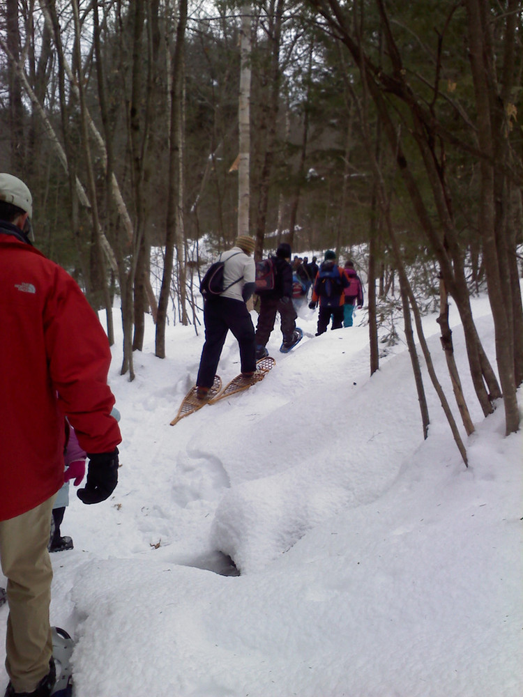 Guided snowshoe hike at a winter family fun event (Credit: Maine Bureau of Parks and Lands)