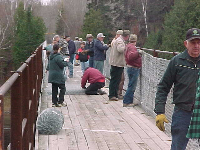 Volunteers putting up fencing on the Crouseville Trestle (Credit: Maine Division of Parks and Public Lands)
