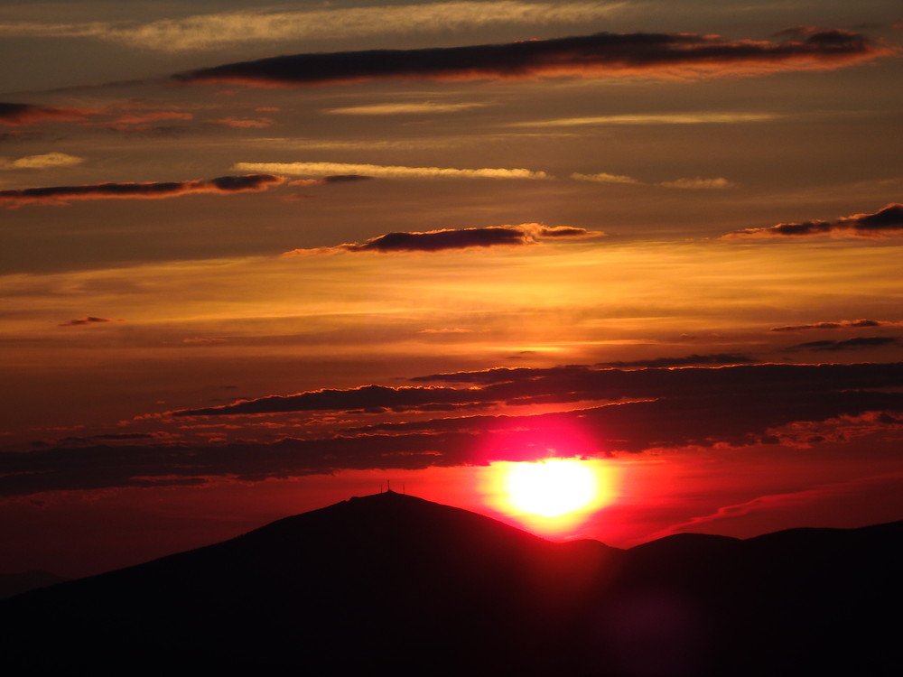 Sunrise on July 6th, 2017 behind Sugarloaf.  Viewed from Saddleback's summit. (Credit: Robert Ratford)