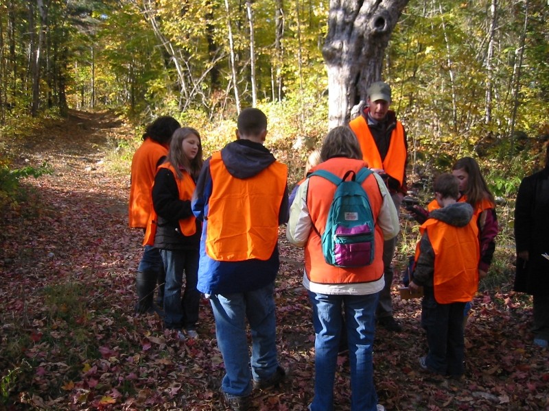 Members of the After School Adventures Club out of Phillips practice using GPS technologies on the Daggett Rock Trail (Credit: Healthy Community Coalition)