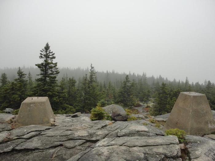 Speckled Mountain summit (no view this day) with remains of fire warden's station foundation (Credit: Remington34)