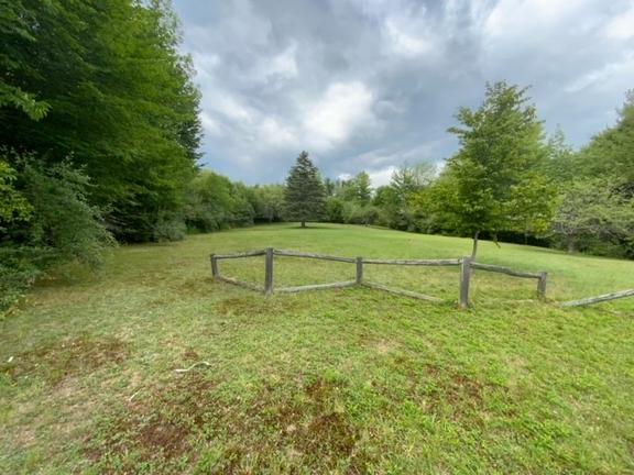 Beautiful 7.7 acre lot in Solon. This partially cleared lot is full of trails amongst the tall pines in the back of the property.