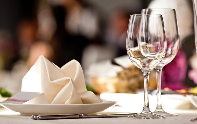 a fancy table in a restaurant with wine glasses
