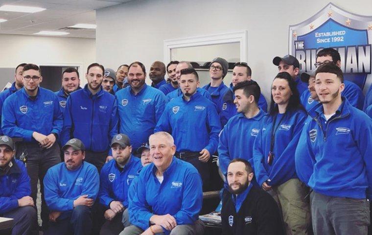 the connecticut pest elimination technicians gathered together for a photo at the office in orange connecticut