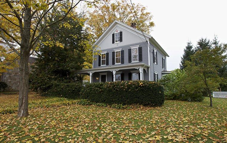 a white three story home in trumbull connecticut