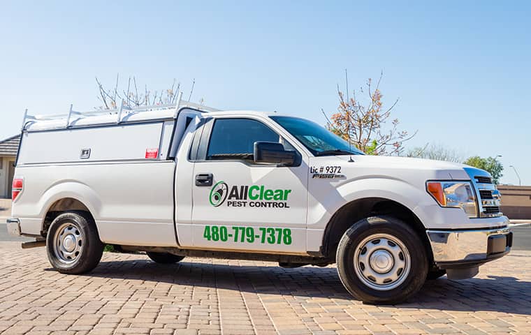 Learn More About Us And Our Pest Control History all clear pest control company vehicle parked outside a home in queen creek arizona