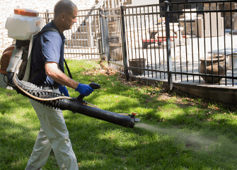 Professional Flea And Tick Control Tulsa OK montgomery exterminating tech treating yard for fleas and ticks
