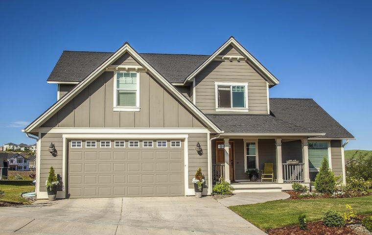 street view of home with garage