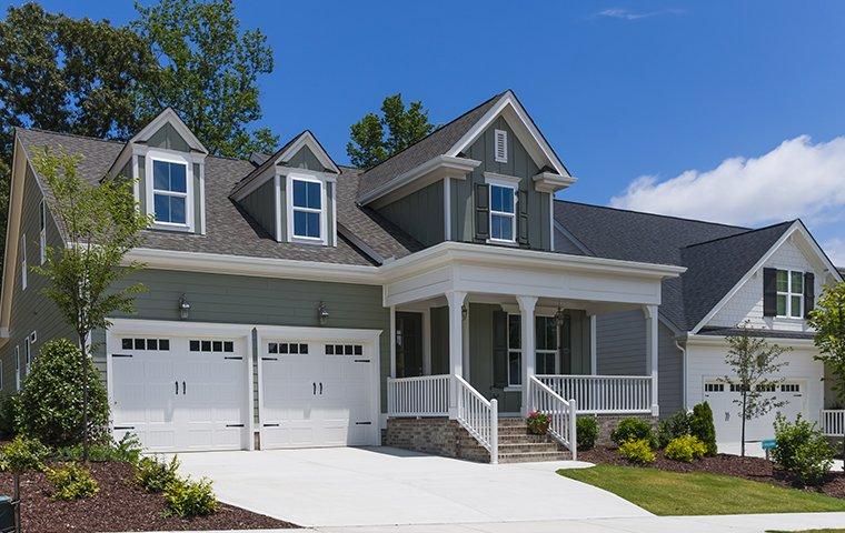 street view of large home with two car garage