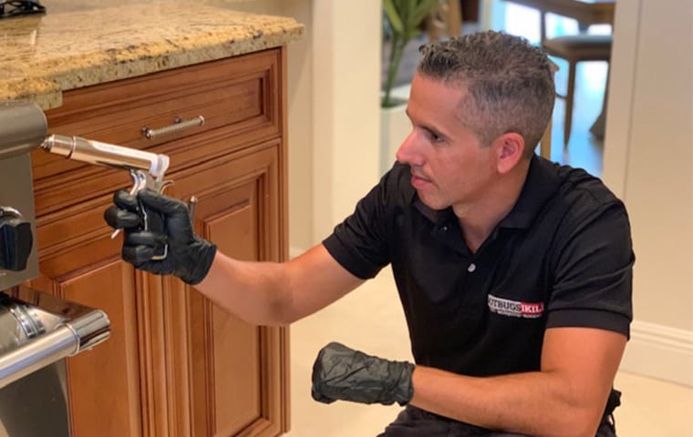We Use Products That Are Safe For You & Your Family gotbugsikill technician applying pest control products that are pet and family friendly in boca raton florida