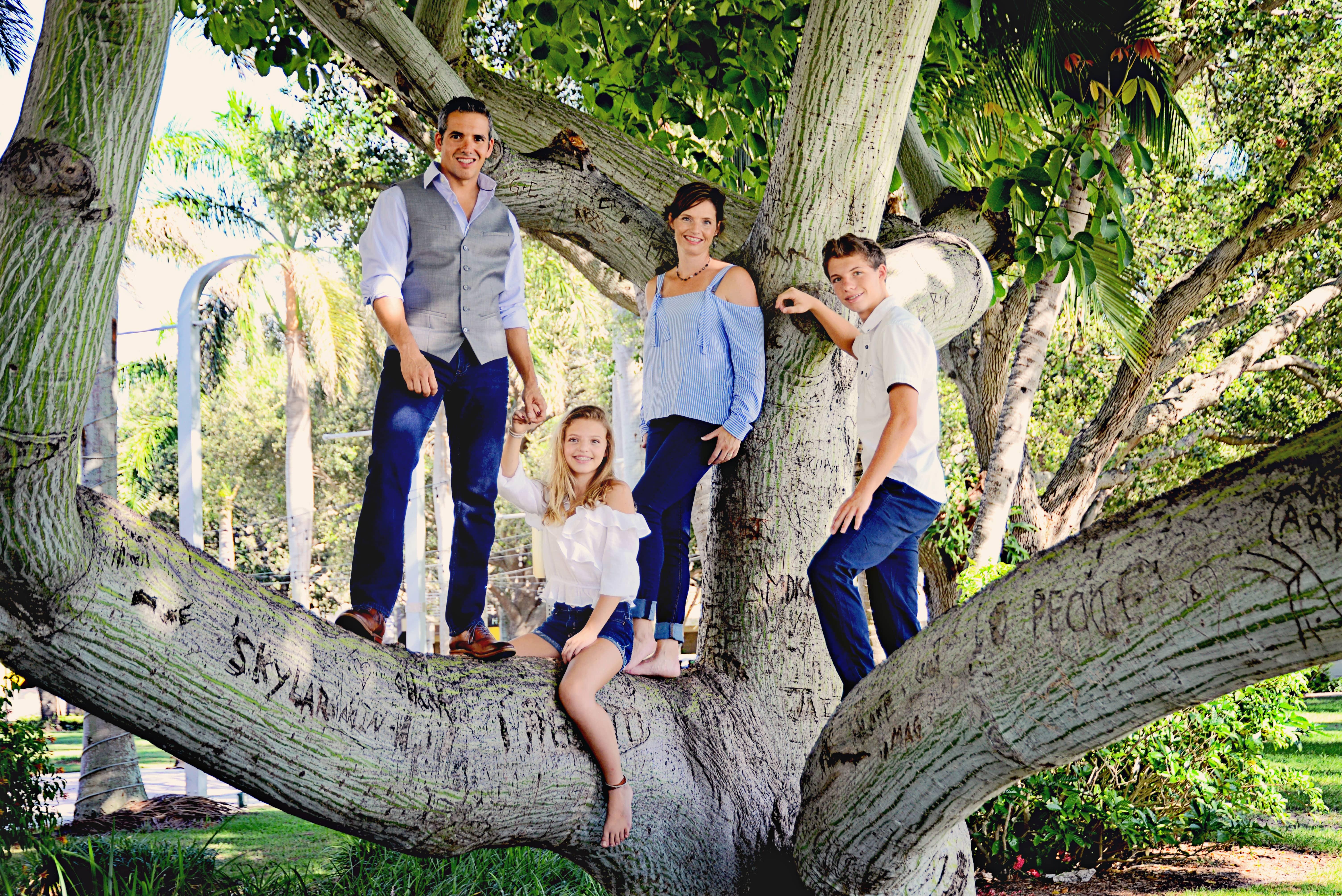 The GOTBUGSIKILLL Family Has Got You Covered! owner of gotbugsikill and his family standing in a tree in boca raton