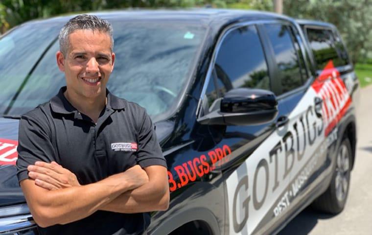 We Eliminate Pests & Provide A Positive Pest Control Experience the company owner standing in front of the company vehicle in boca raton florida