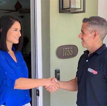 Learn About Our KILL365 General Pest Plan a homeowner and the gotbugsikill owner outside of a home in boca raton florida