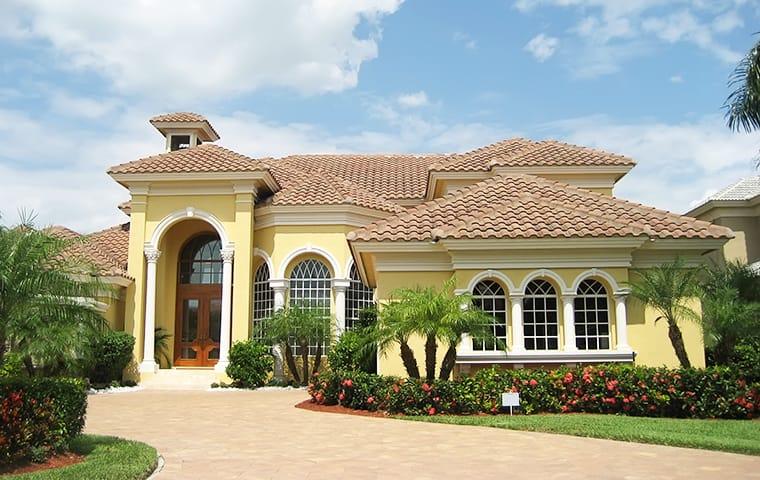 Keep German Roaches Away With A Prevention Plan street view of a large yellow house in parkland florida