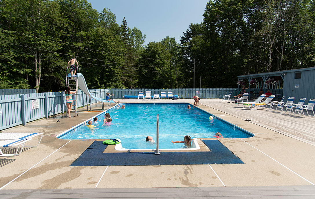 Swim At Smuggler's Den heated pool with slide at campground on mount desert island