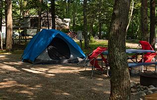 Tent & Pop-up Sites Available At Smuggler's campsite with tent at smuggler's den campground