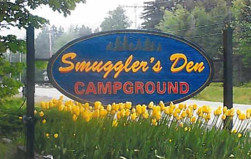 Join Us At Smuggler's Den Campground road sign for smuggler's den campground