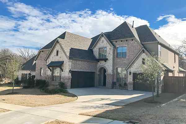 street view of brick home in conroe texas