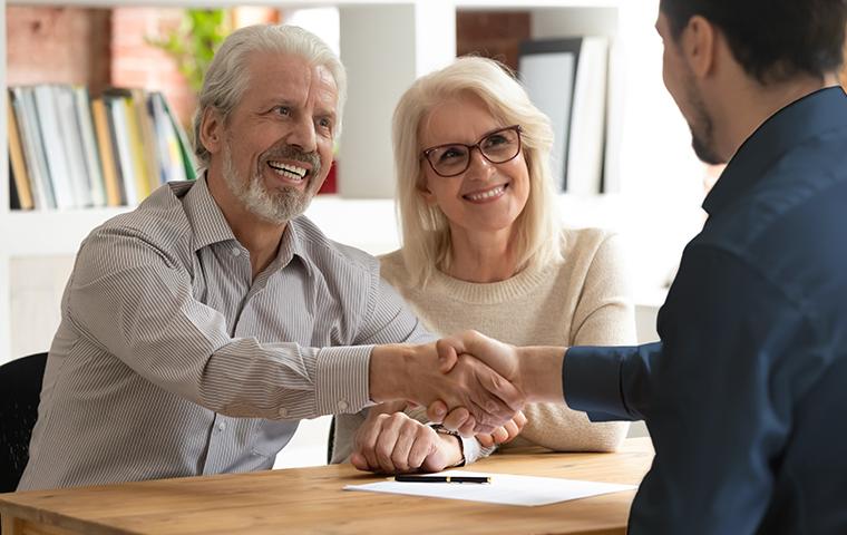 technician shaking homeowners hand