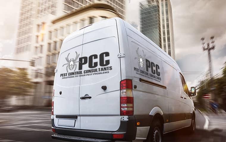 a pest control consultants company vehicle in a commercial business district in st charles illinois