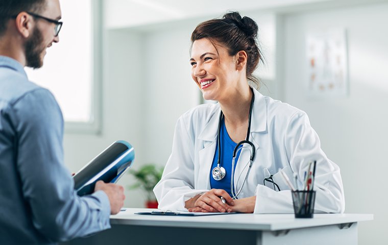 a friendly doctor talking with patient