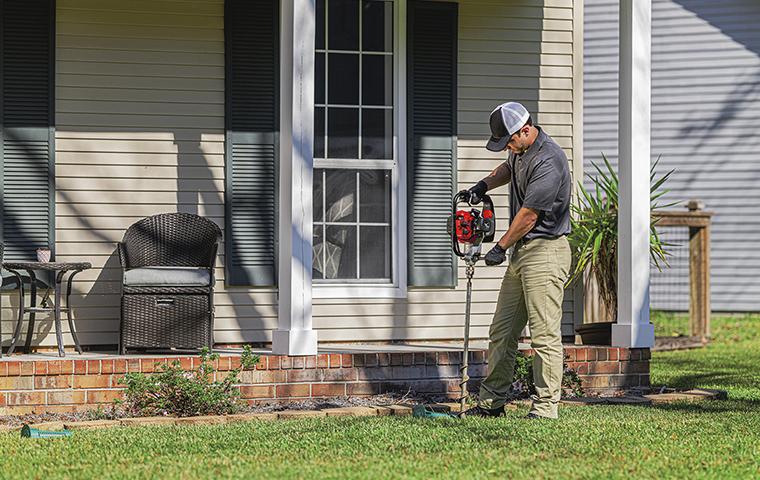 a tech outside a home