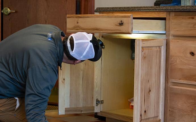 We Start With A Thorough Inspection a technician performing an inspection in a yakima home