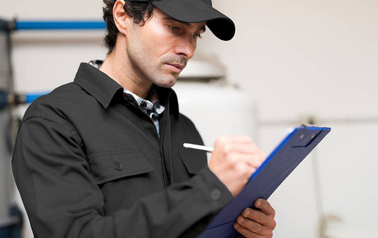 a tech inspecting inside a home