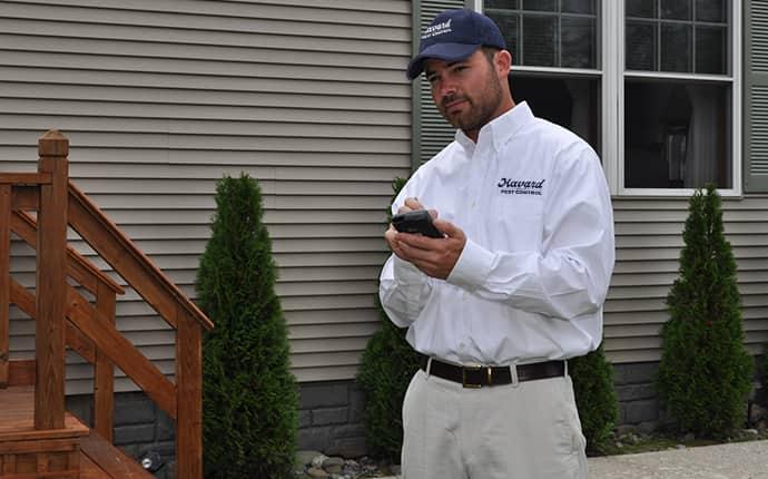 havard pest control technician performing a follow-up rodent control visit