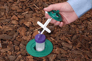 Learn How Adams Exterminating Company Can Protect Your Home From Termites termite bait station being installed