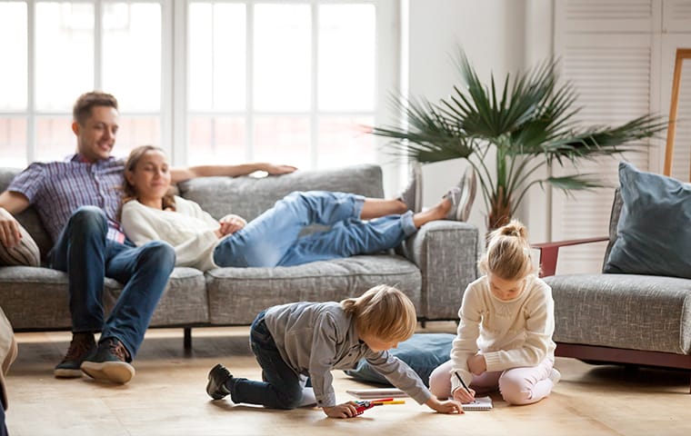 Protect Your Properties & Tenants From Bed Bug Infestations a family and dog inside of an apartment room serviced by thermalrid in nashville tennessee