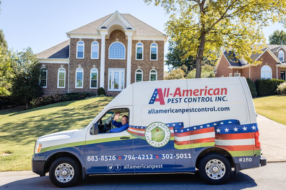 brian waving from a company vehicle