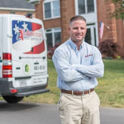 all-american technician outside of a home beside service van