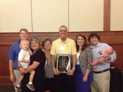 al foster and his family receiving the award