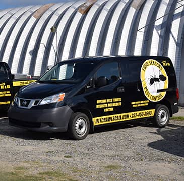 Learn More About Our Pest Control History a four seasons hometown pest control company vehicle parked outside in outerbanks north carolina