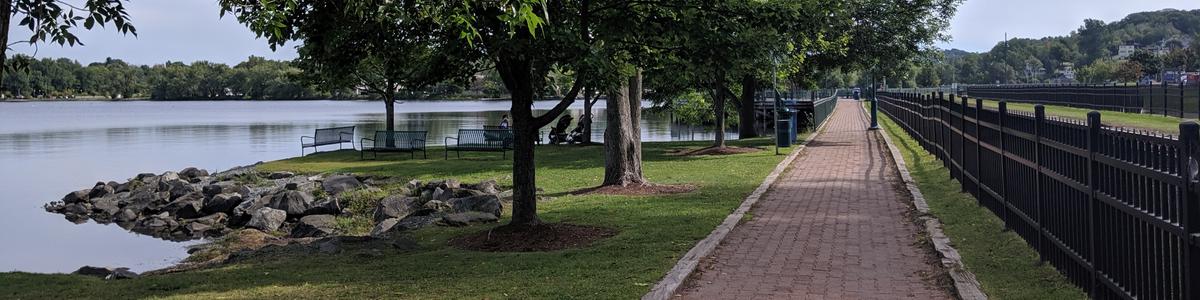 A lake side trail is paved with bricks