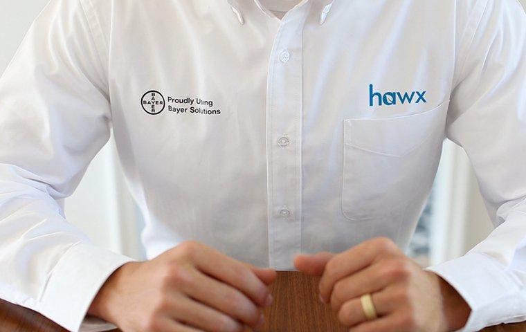 a hawx pest control service technician