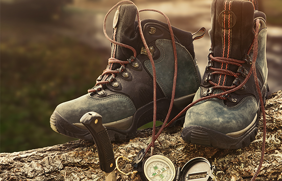 hiking boots knife and compass