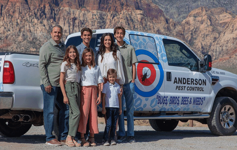 the anderson family in front of the anderson pest control truck