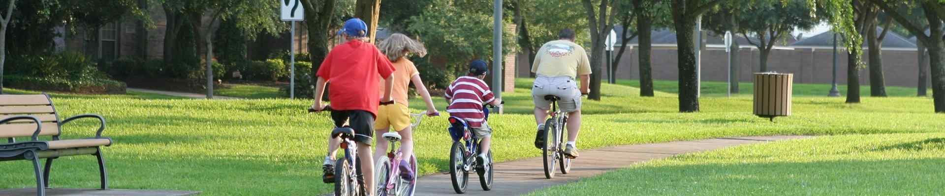 a family on bikes in a park in bedford texas