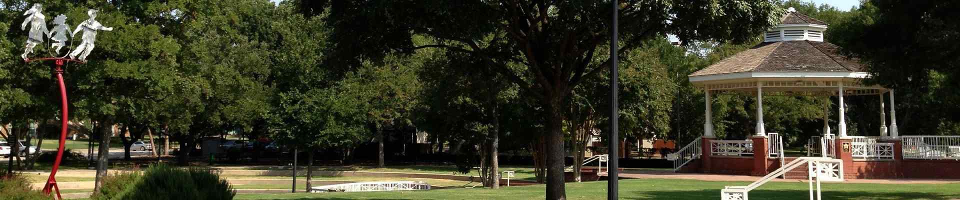 a view of a park and gazebo in plano texas