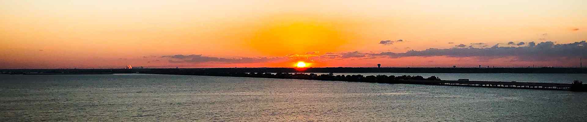 a sunset over the water in rockwall texas