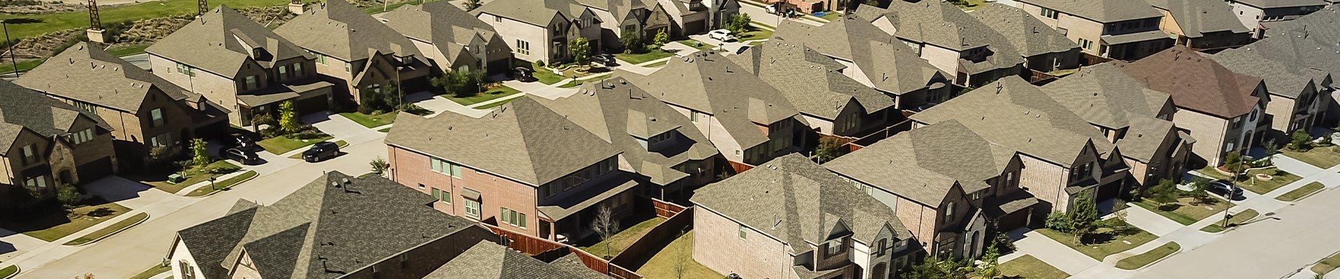 a row of homes in a suburban neighborhood in spring texas
